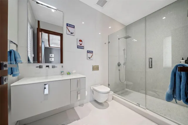 a kitchen with granite countertop cabinets stainless steel appliances a sink and a large window