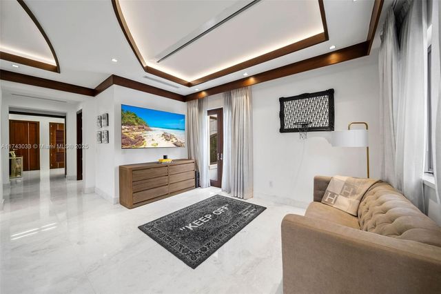 a kitchen with granite countertop white cabinets and sink