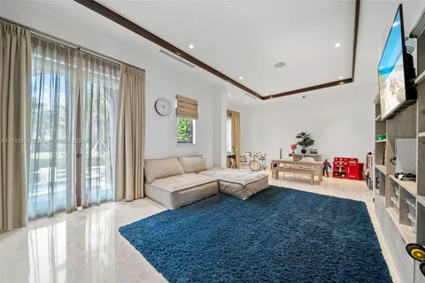 a living room with lots of furniture and gym equipment