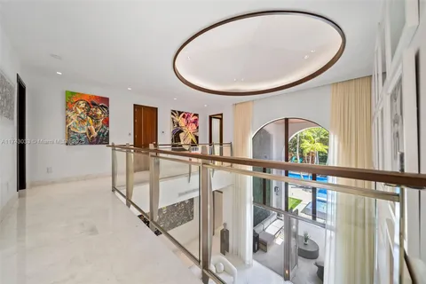 a view of a house with swimming pool and sitting area