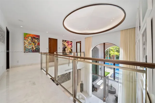 a view of a house with swimming pool and sitting area