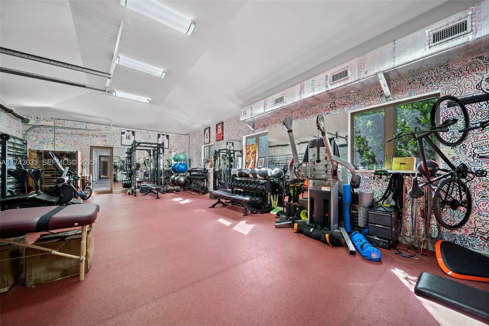 8955 Southwest 63rd Court Pinecrest, FL 33156 - Photo 49 of 59 a view of a room with gym equipment