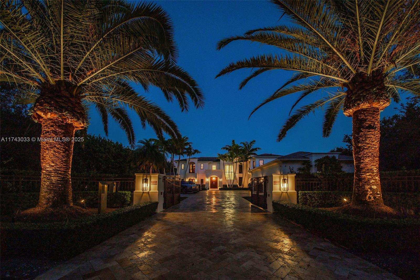 8955 Southwest 63rd Court Pinecrest, FL 33156 - Photo 56 of 59 a view of a house with a yard