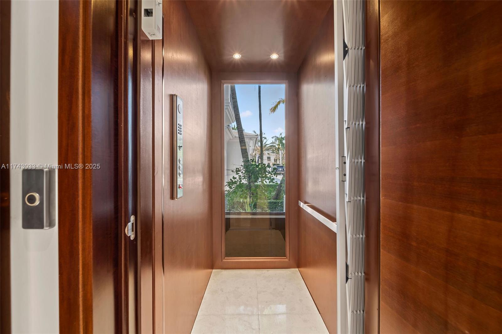 8955 Southwest 63rd Court Pinecrest, FL 33156 - Photo 57 of 59 a view of a hallway with wooden floor