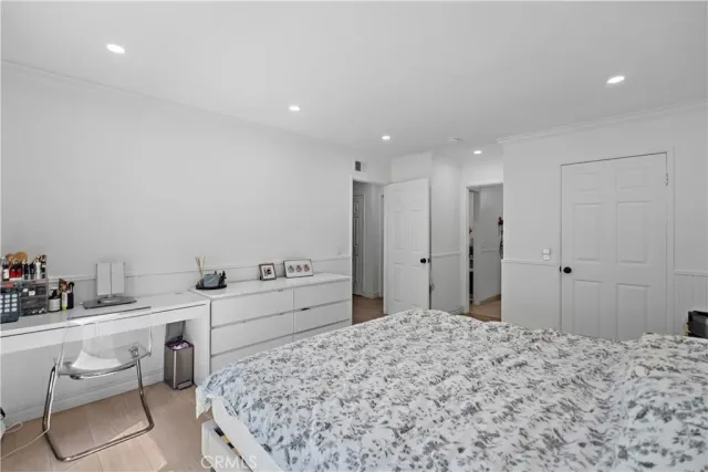 a bedroom with a bed and a cabinets