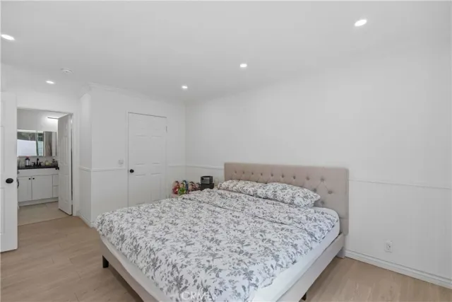 a bedroom with a bed and a view of bathroom