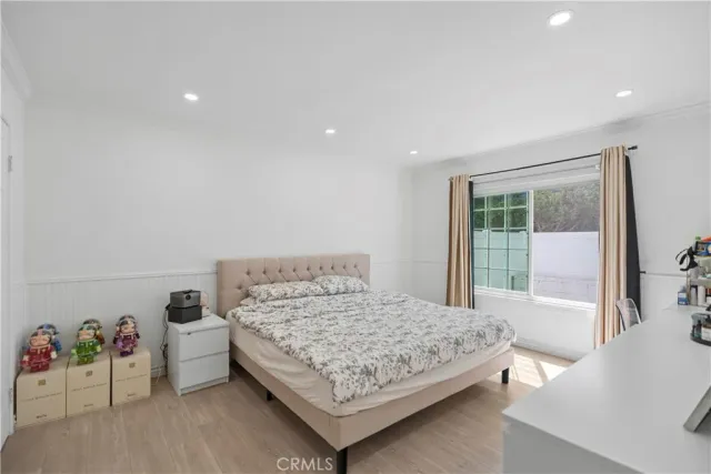 a bedroom with a bed and a view of bathroom