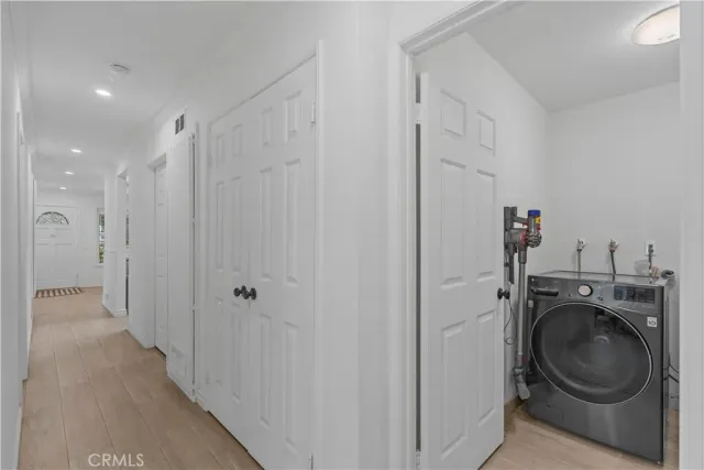 a view of a storage & utility room with a washer dryer