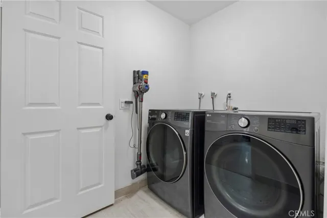 a bedroom with a bed and a desk