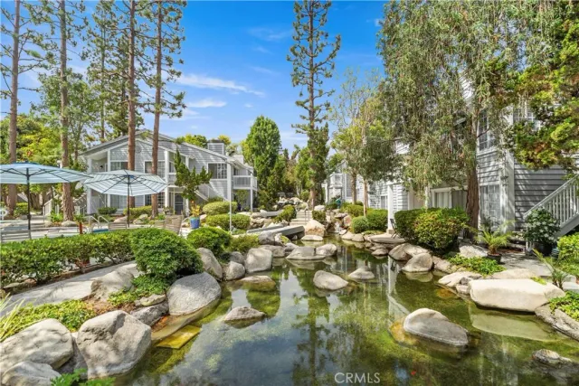 a swimming pool with outdoor seating and yard