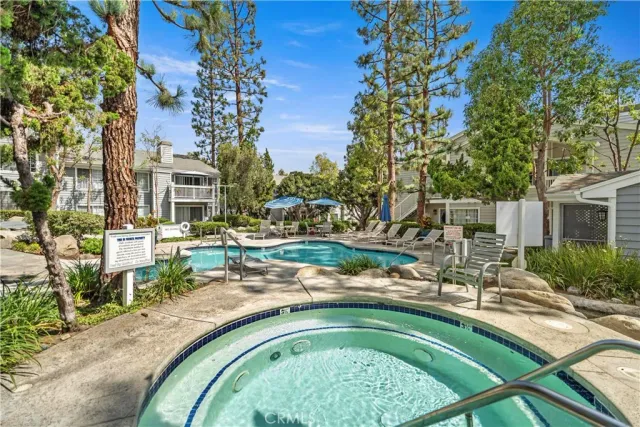 a swimming pool with outdoor seating and yard