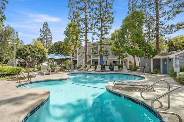 a view of a lake with a house and a yard