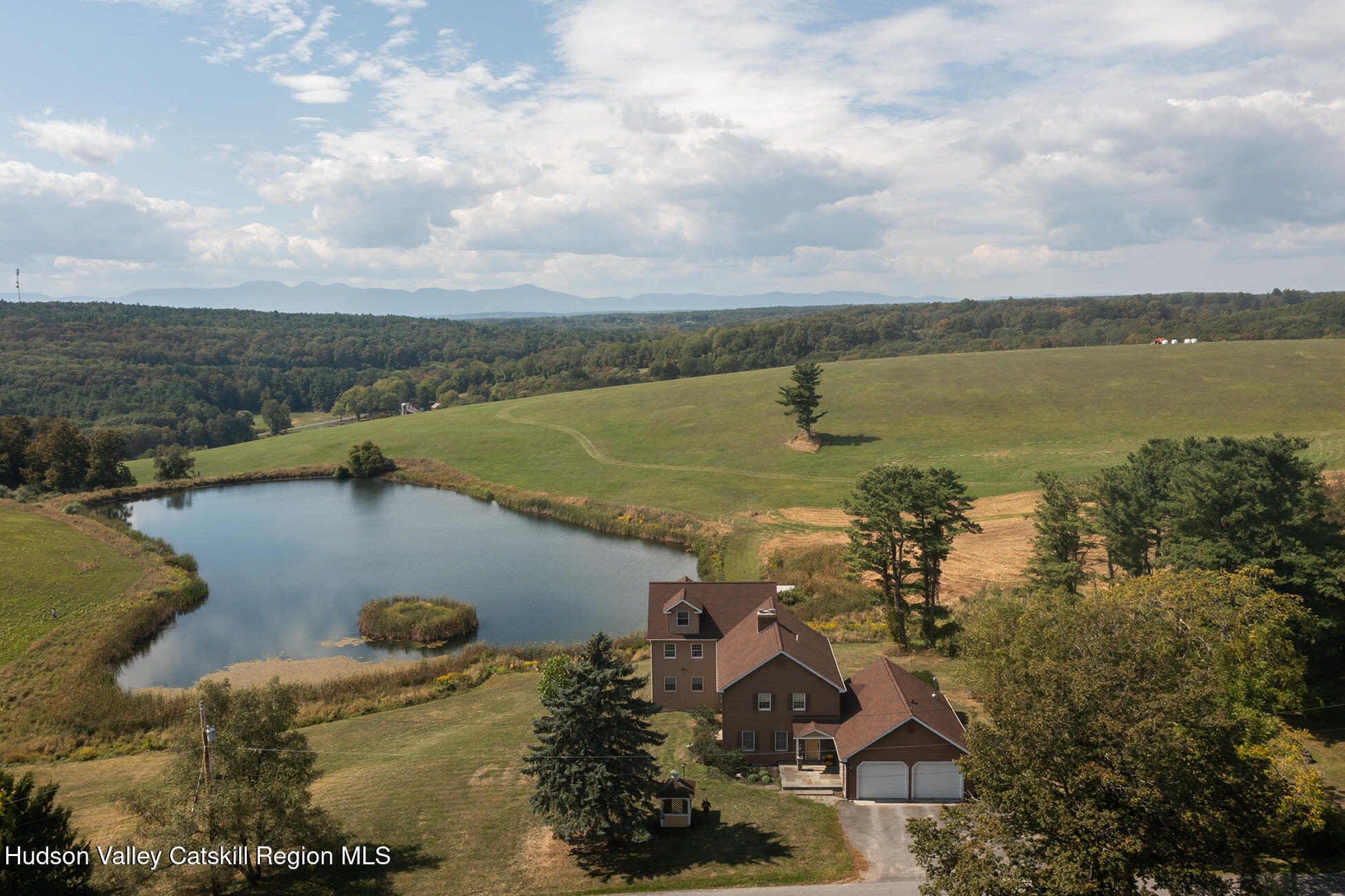 an aerial view of a house with a lake view