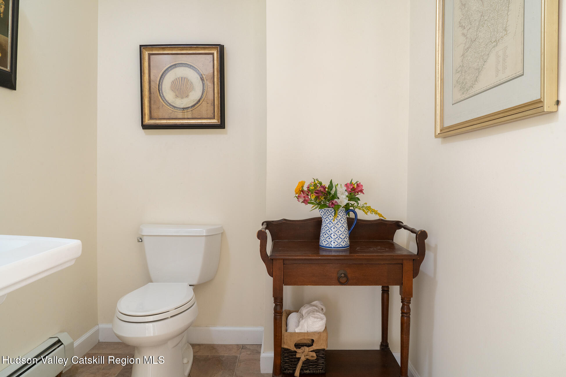 369 Highmount Road West Coxsackie, NY 12192 - Photo 8 of 24 a white toilet sitting next to a bathroom sink