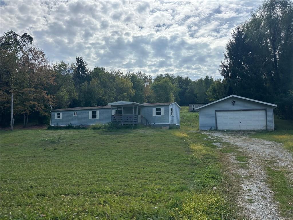 156 Spring Street Yukon, PA 15698 - Photo 1 of 5 a view of a barn in the middle of a yard
