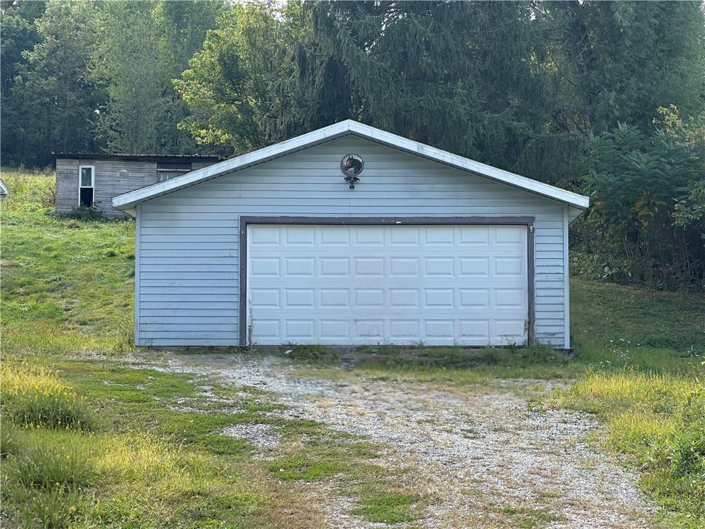156 Spring Street Yukon, PA 15698 - Photo 3 of 5 a house view with a backyard space