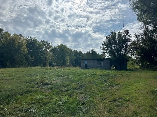 a fire hydrant in the middle of a field