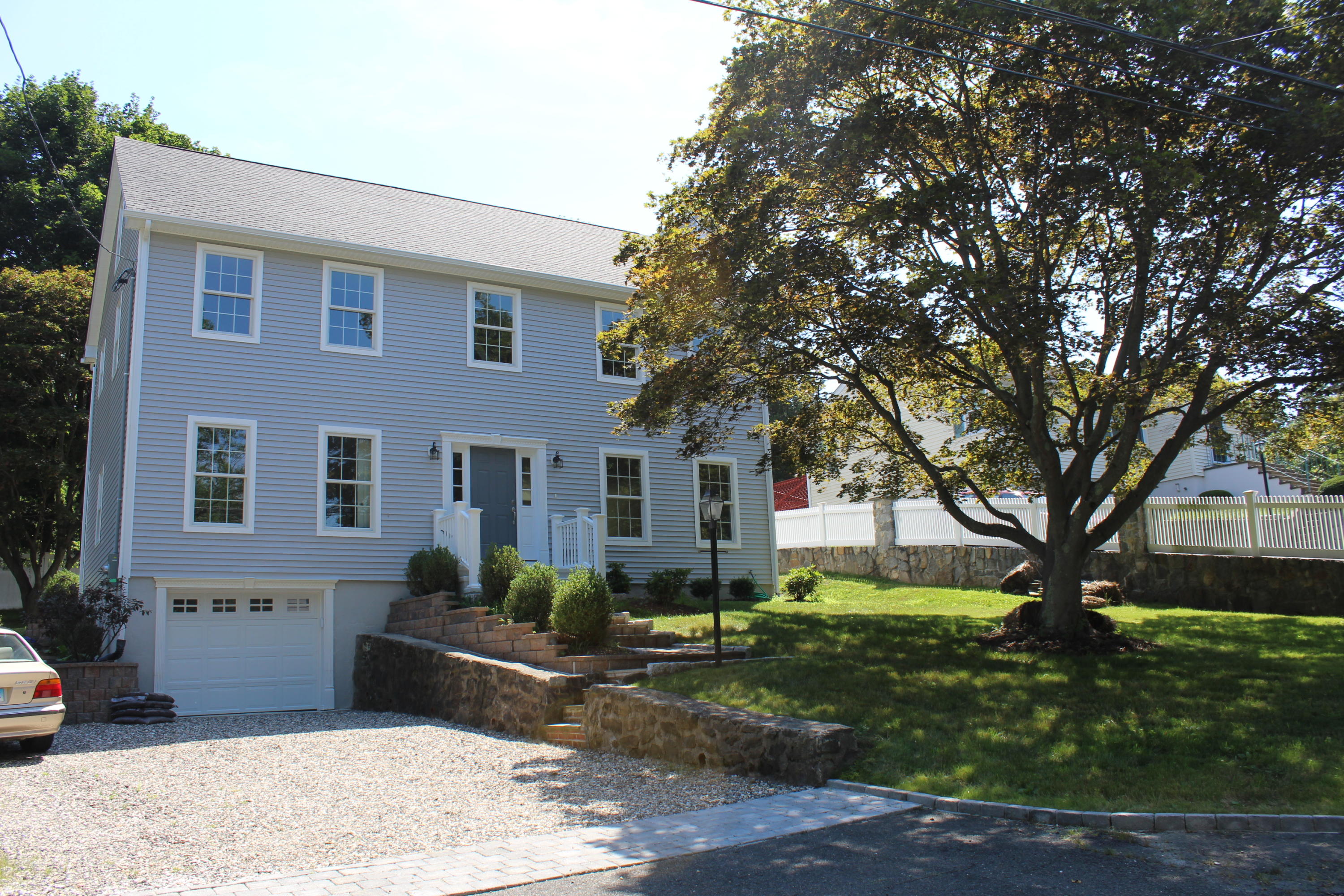16 Knollwood Road Norwalk, CT 06854 - Photo 1 of 29 a front view of a house with garden