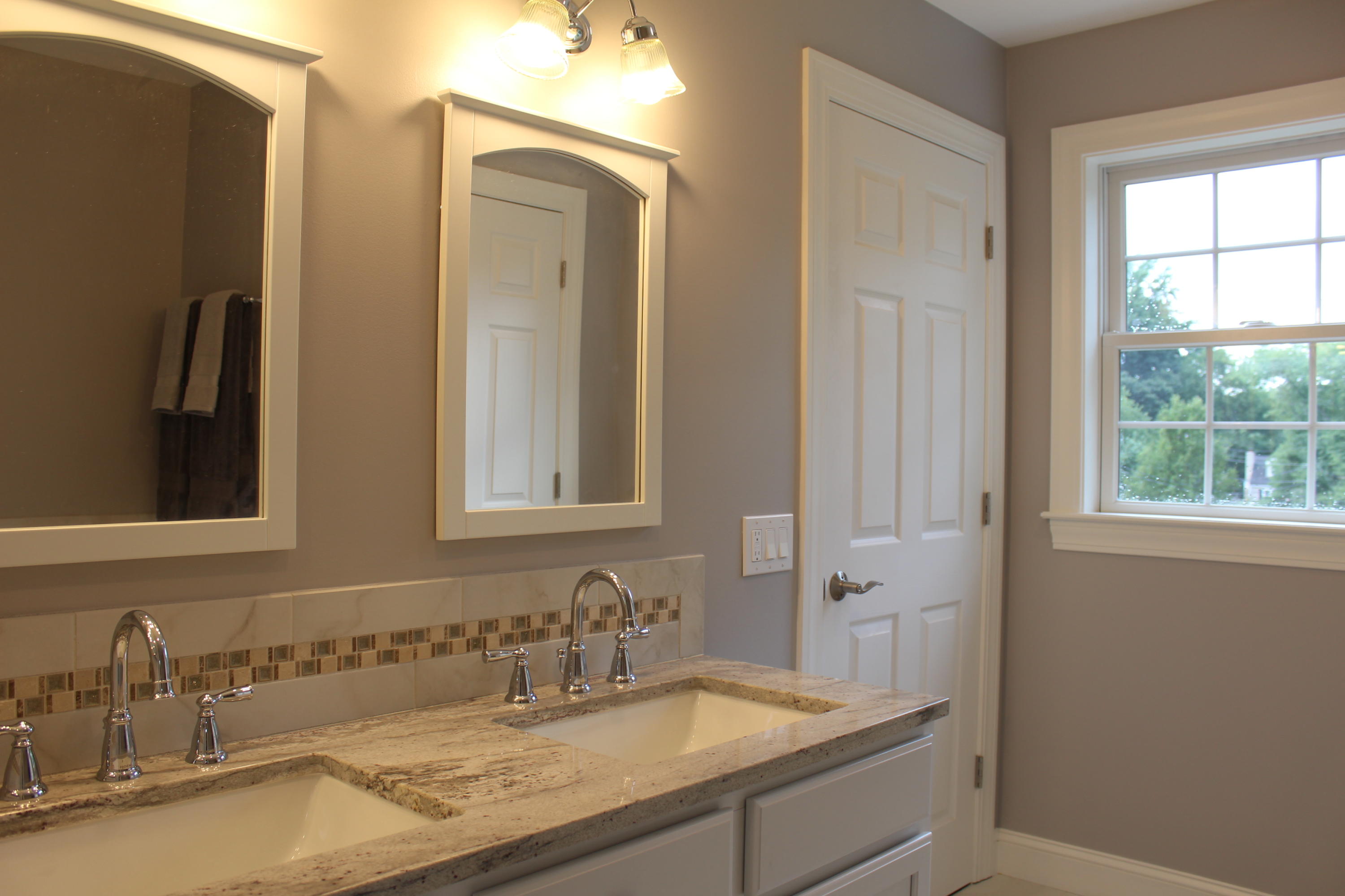 16 Knollwood Road Norwalk, CT 06854 - Photo 15 of 29 a bathroom with a sink and a mirror