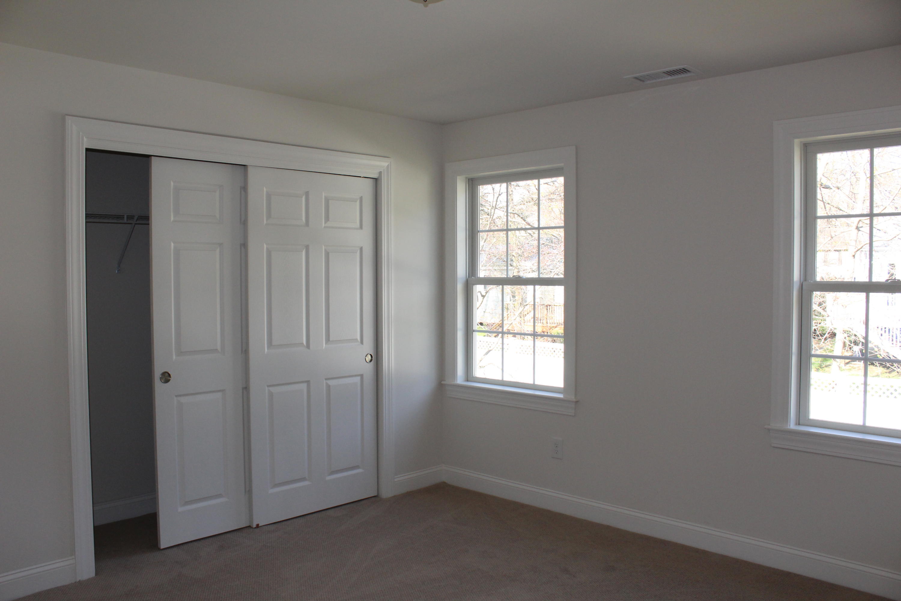 16 Knollwood Road Norwalk, CT 06854 - Photo 19 of 29 an empty room with windows and closet