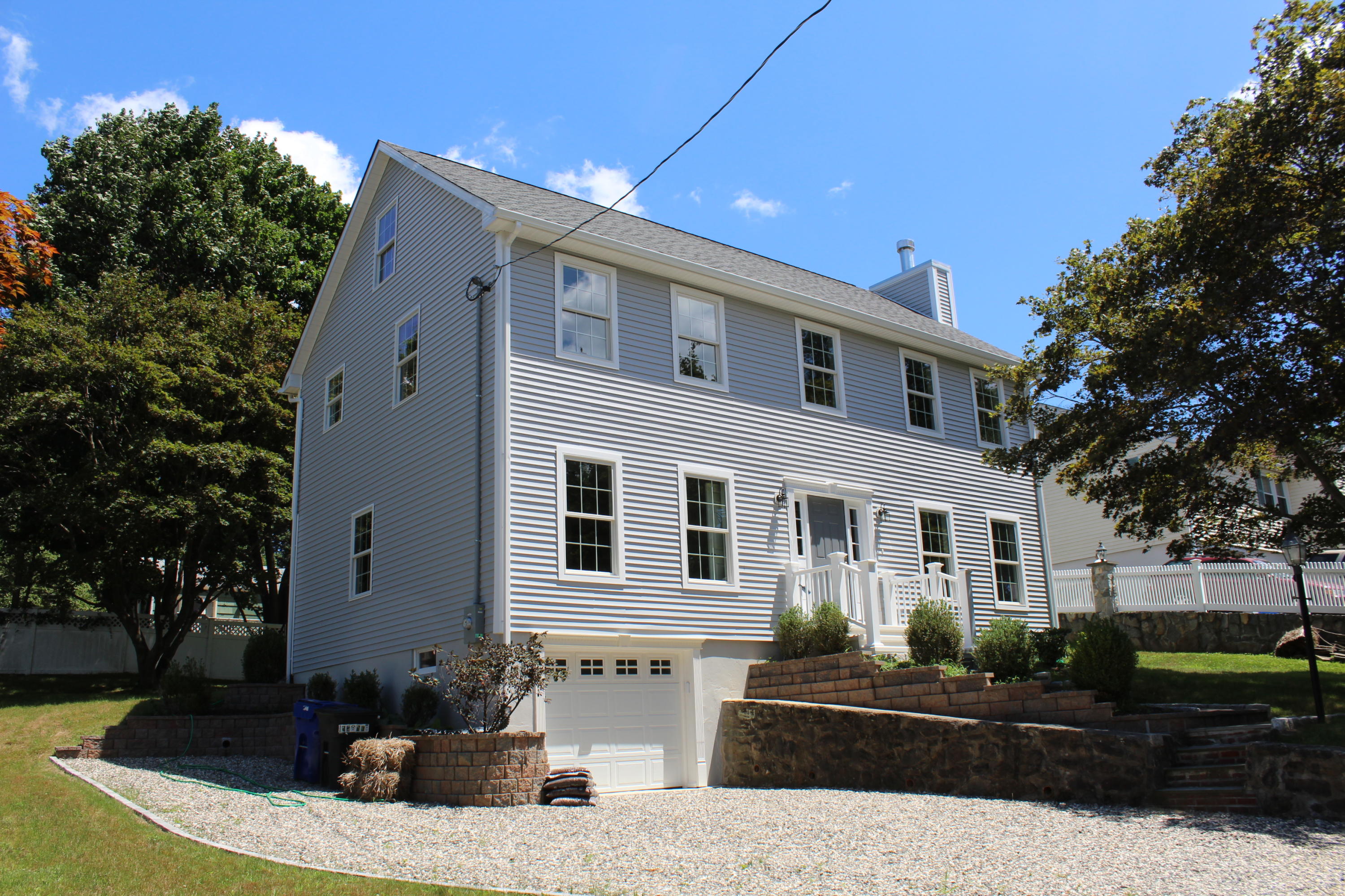 16 Knollwood Road Norwalk, CT 06854 - Photo 2 of 29 a front view of a house with a yard