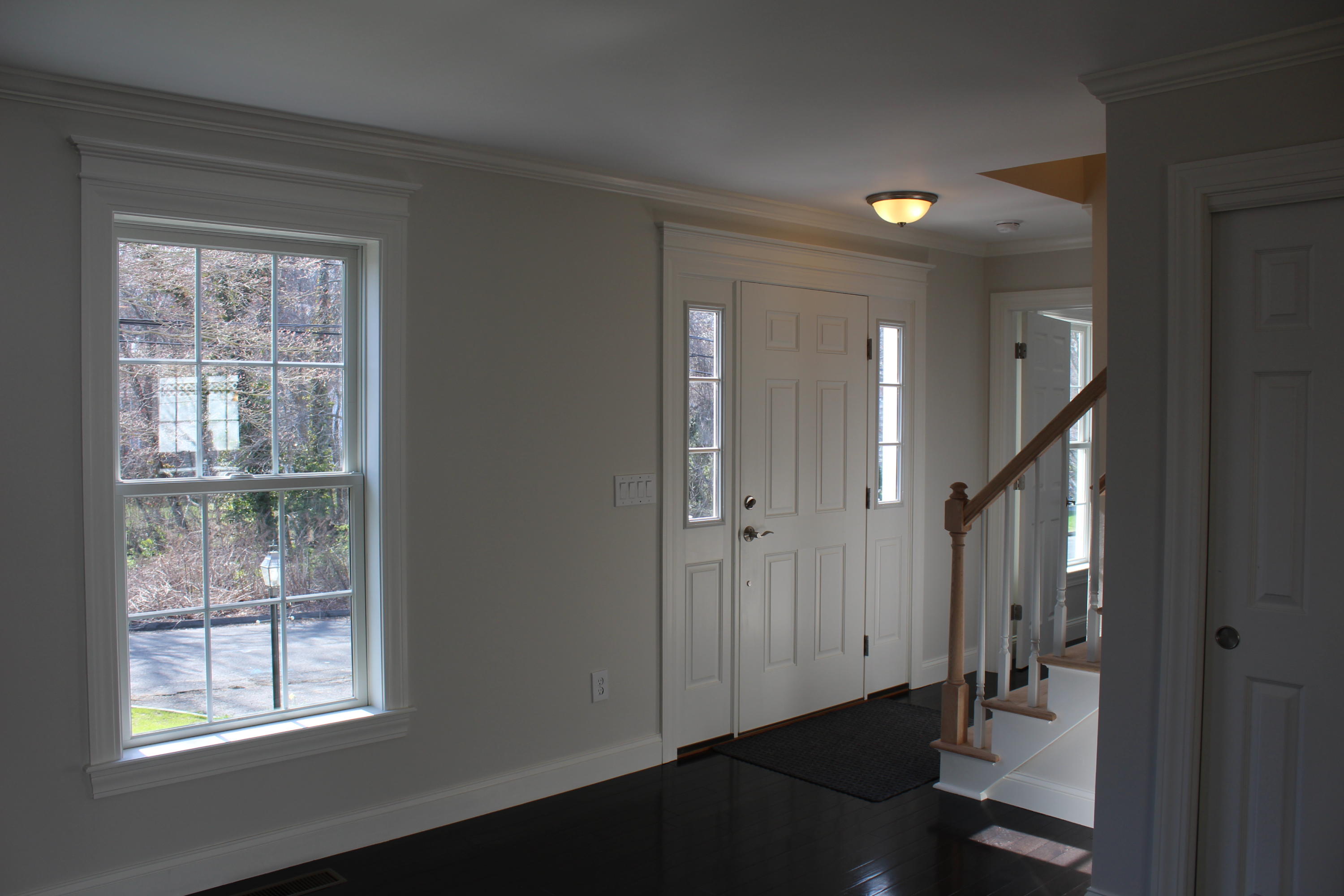 16 Knollwood Road Norwalk, CT 06854 - Photo 4 of 29 a view of a hallway with windows and stairs
