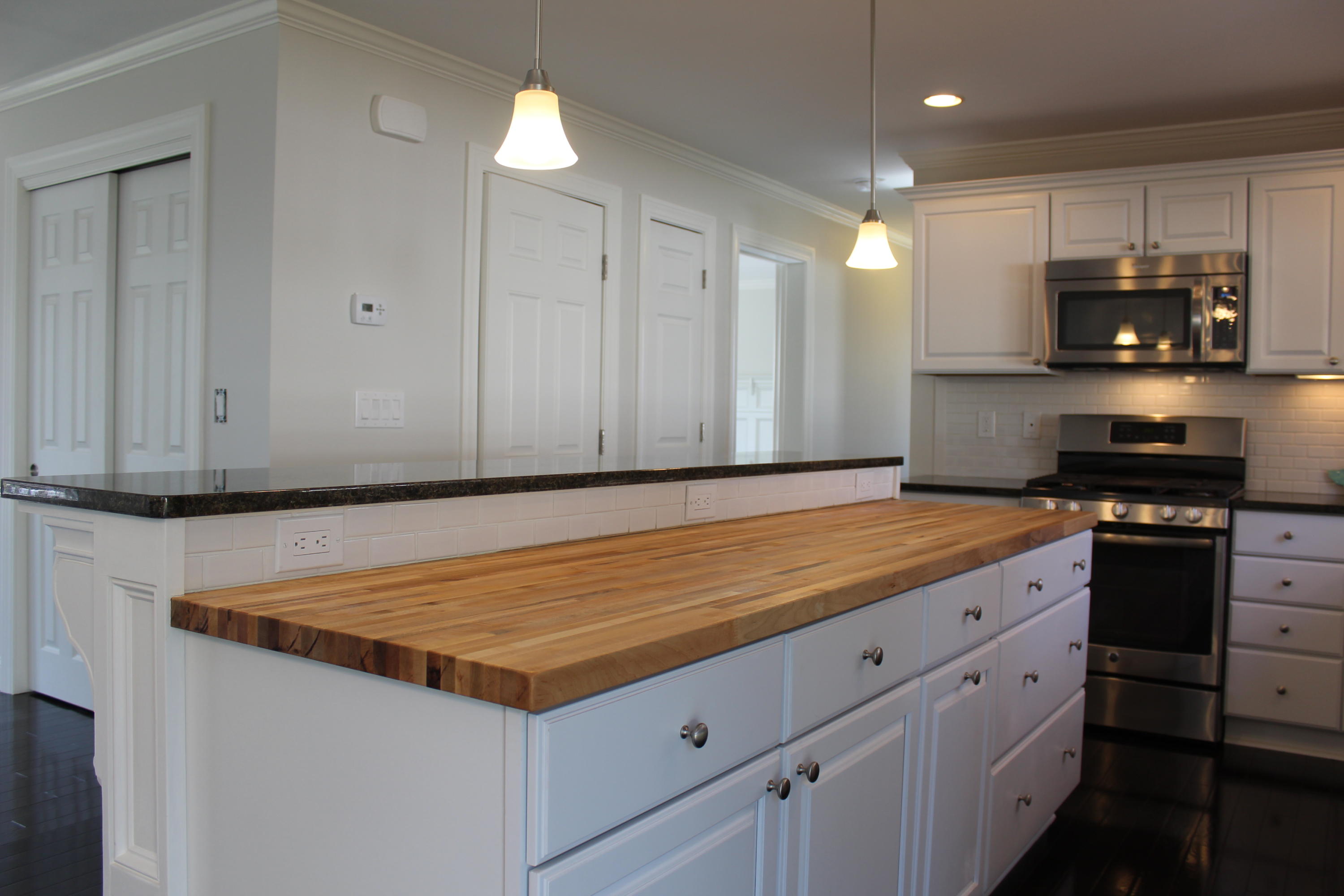 16 Knollwood Road Norwalk, CT 06854 - Photo 9 of 29 a kitchen with stainless steel appliances granite countertop a stove a sink and a refrigerator