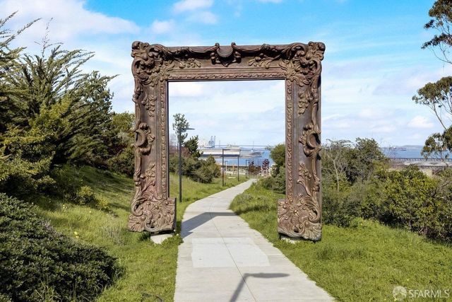 a view of a swimming pool with lounge chairs