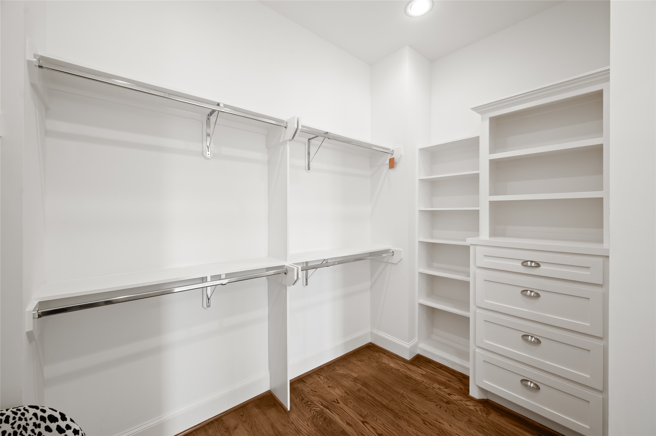 1003 East 25th Street Houston, TX 77009 - Photo 25 of 33 Complete with built-ins, shelving and tons of hanging space, the primary closet finishes out the full primary suite.