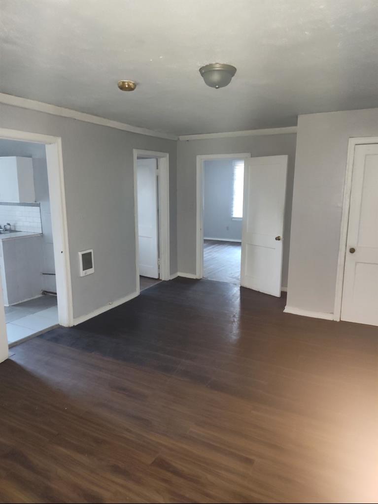 2738 Baldwin Street Columbus, GA 31906 - Photo 6 of 13 a view of an empty room with wooden floor and a window