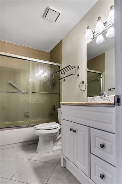6751 Boca Pines Trail, Unit F Boca Raton, FL 33433 - Photo 20 of 24 a bathroom with a sink toilet and shower