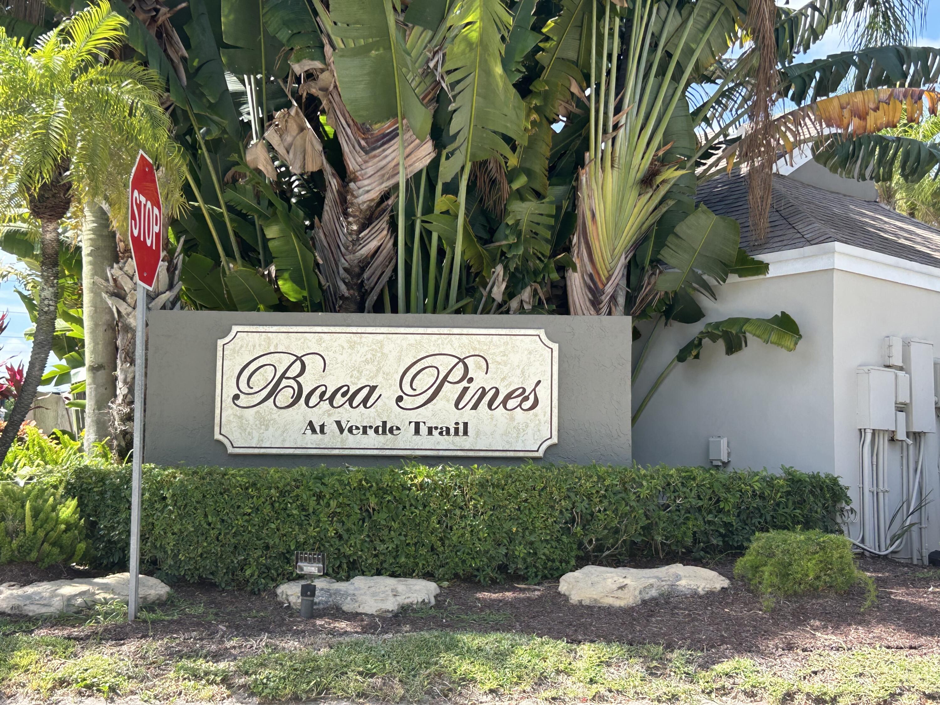 6751 Boca Pines Trail, Unit F Boca Raton, FL 33433 - Photo 2 of 24 a sign broad on the side of the road