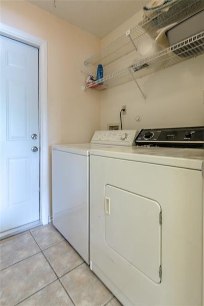 6751 Boca Pines Trail, Unit F Boca Raton, FL 33433 - Photo 22 of 24 a utility room with dryer and washer