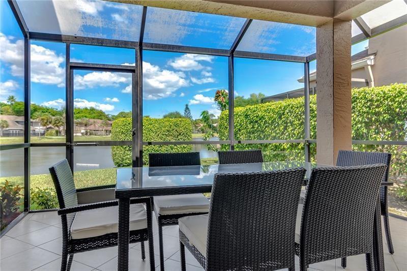 6751 Boca Pines Trail, Unit F Boca Raton, FL 33433 - Photo 9 of 24 a dining room with furniture and window