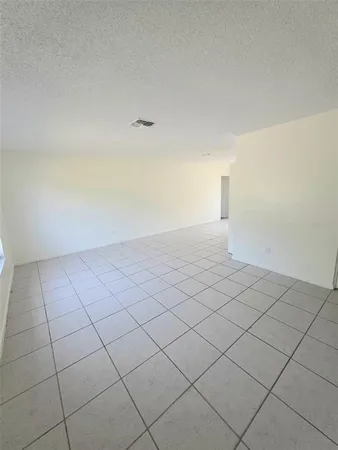 a view of an empty room and storage