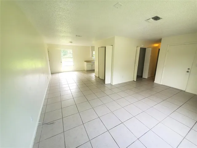 a view of a livingroom with an empty space and a sink