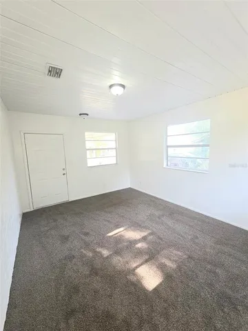 an empty room with a empty space and window