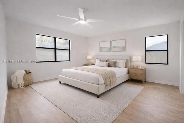 a bedroom with a bed and window