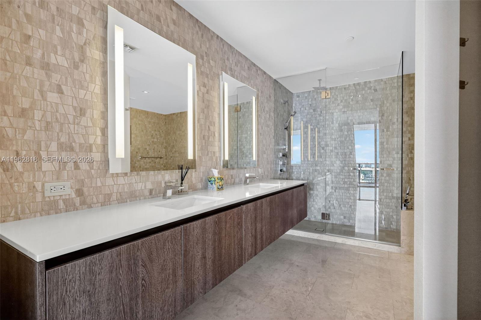 88 Southwest 7th Street, Unit 2402 Miami, FL 33130 - Photo 16 of 38 a bathroom with a double vanity sink mirror and double