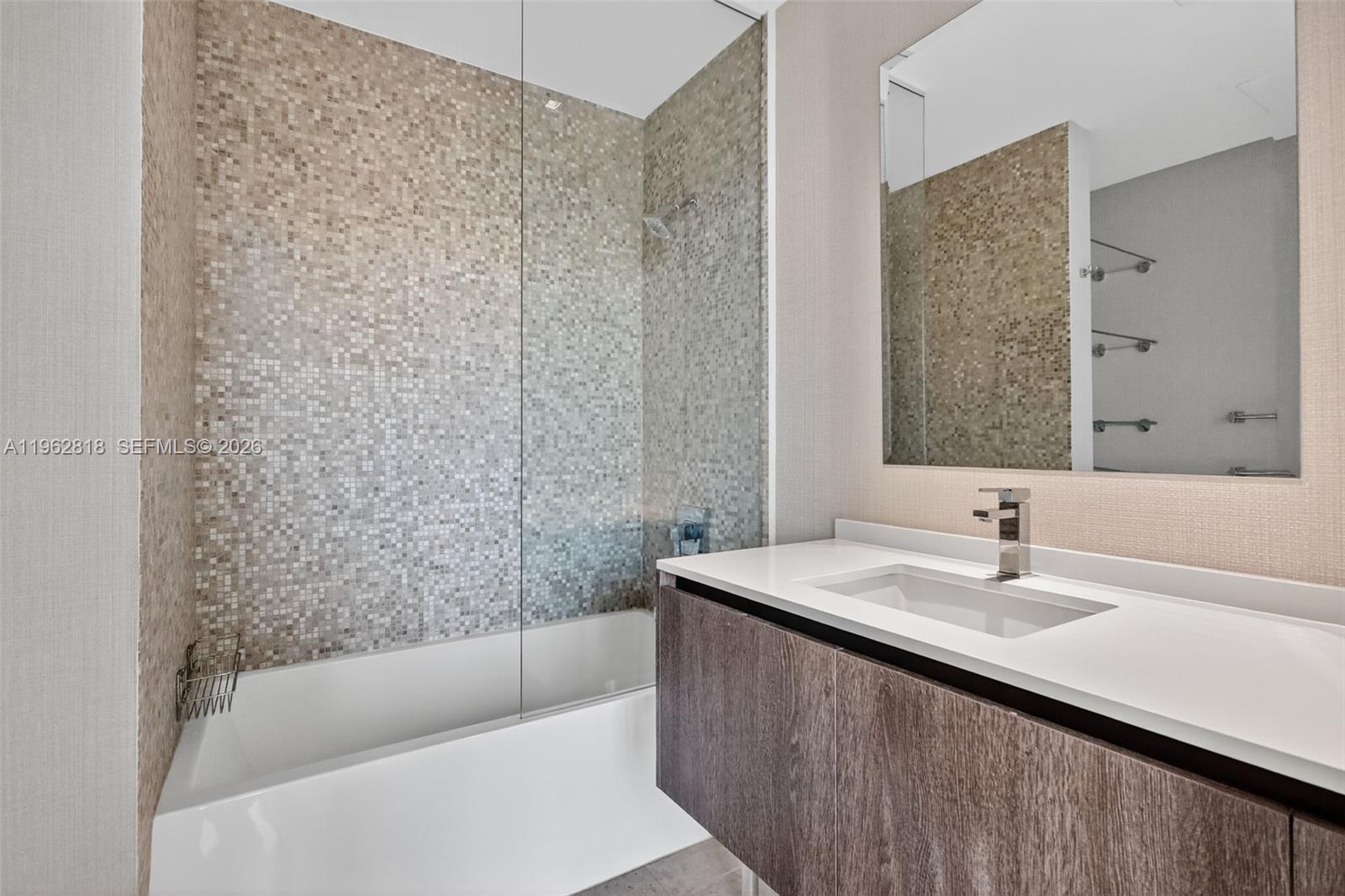 88 Southwest 7th Street, Unit 2402 Miami, FL 33130 - Photo 27 of 38 a bathroom with a sink and a bathtub