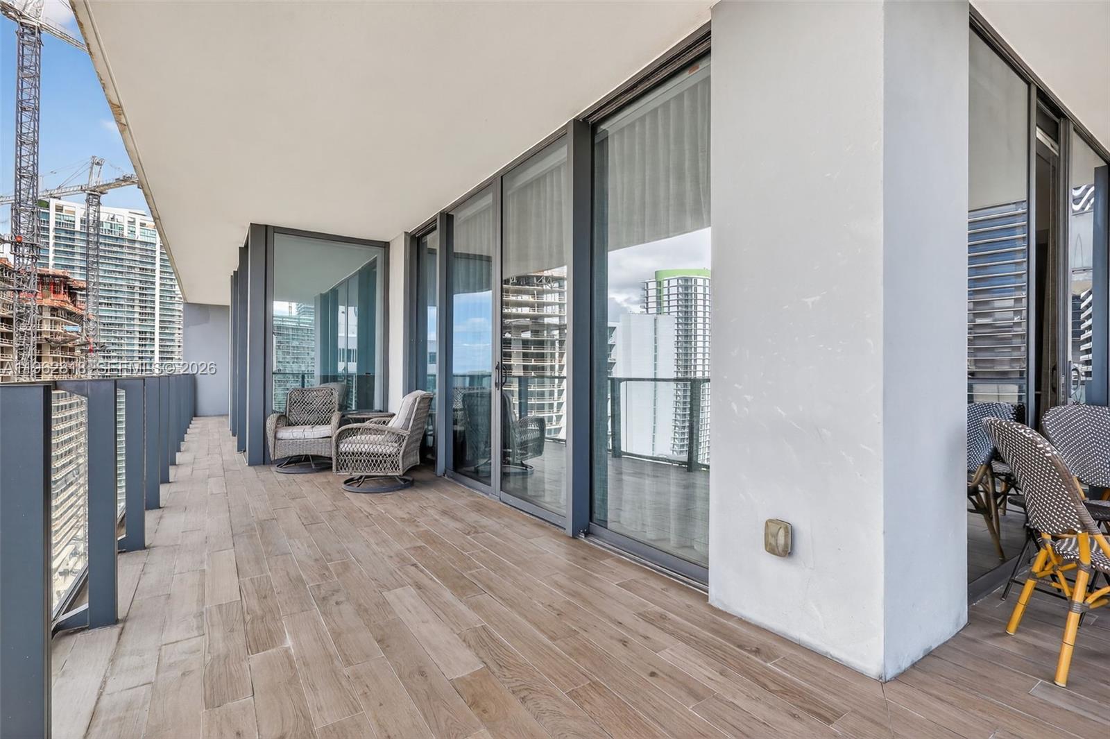 88 Southwest 7th Street, Unit 2402 Miami, FL 33130 - Photo 10 of 38 a view of a livingroom with furniture and windows