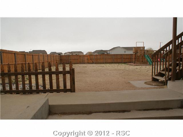 8317 Weiscamp Road Peyton, CO 80831 - Photo 14 of 16 1 Acre Lot also has enclosed privacy fence and play set