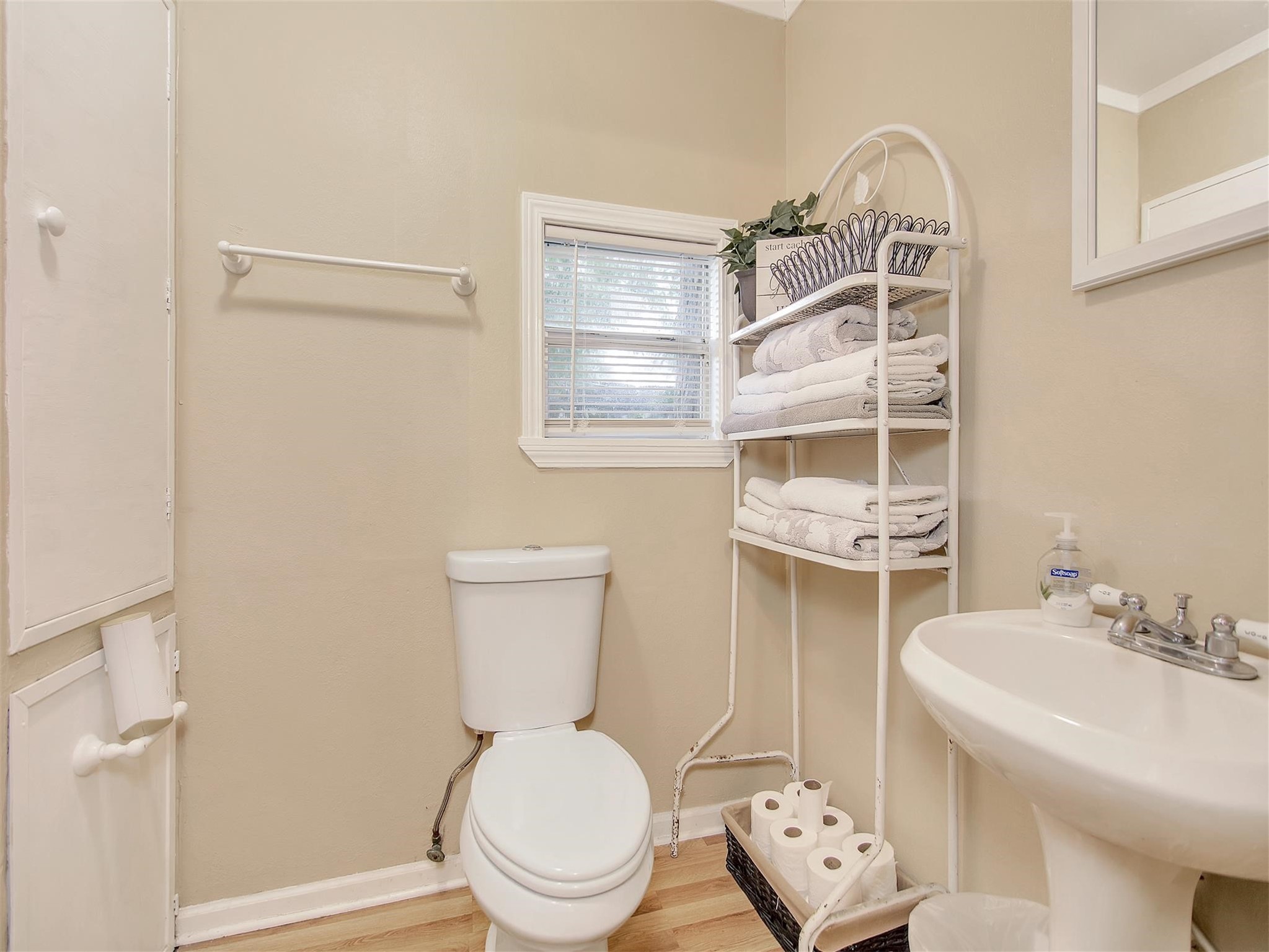 5207 McCormick Street Houston, TX 77023 - Photo 16 of 33 a white toilet sitting next to a bathroom sink