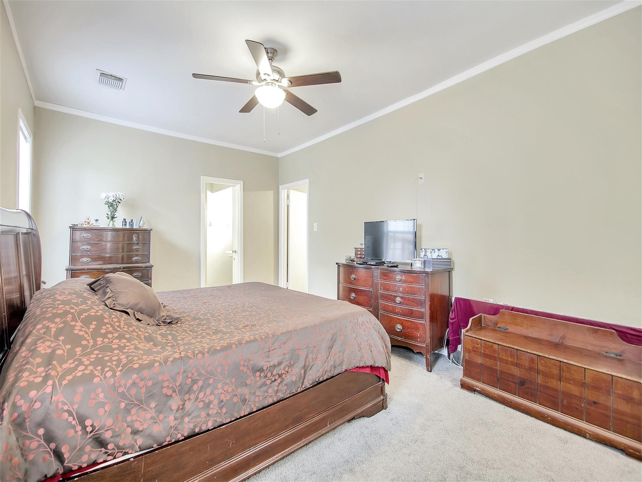 5207 McCormick Street Houston, TX 77023 - Photo 18 of 33 a bedroom with a bed and dresser