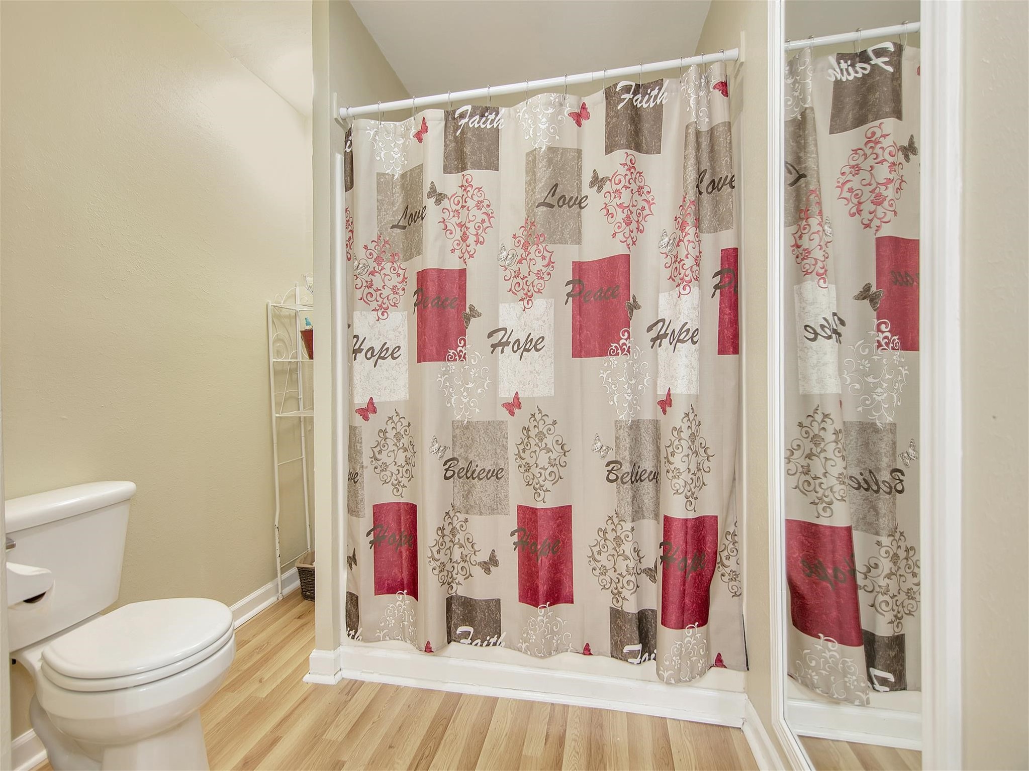 5207 McCormick Street Houston, TX 77023 - Photo 23 of 33 a bathroom with a shower curtain