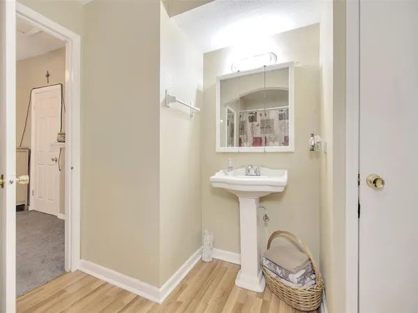 a bathroom with a sink a mirror and a shower