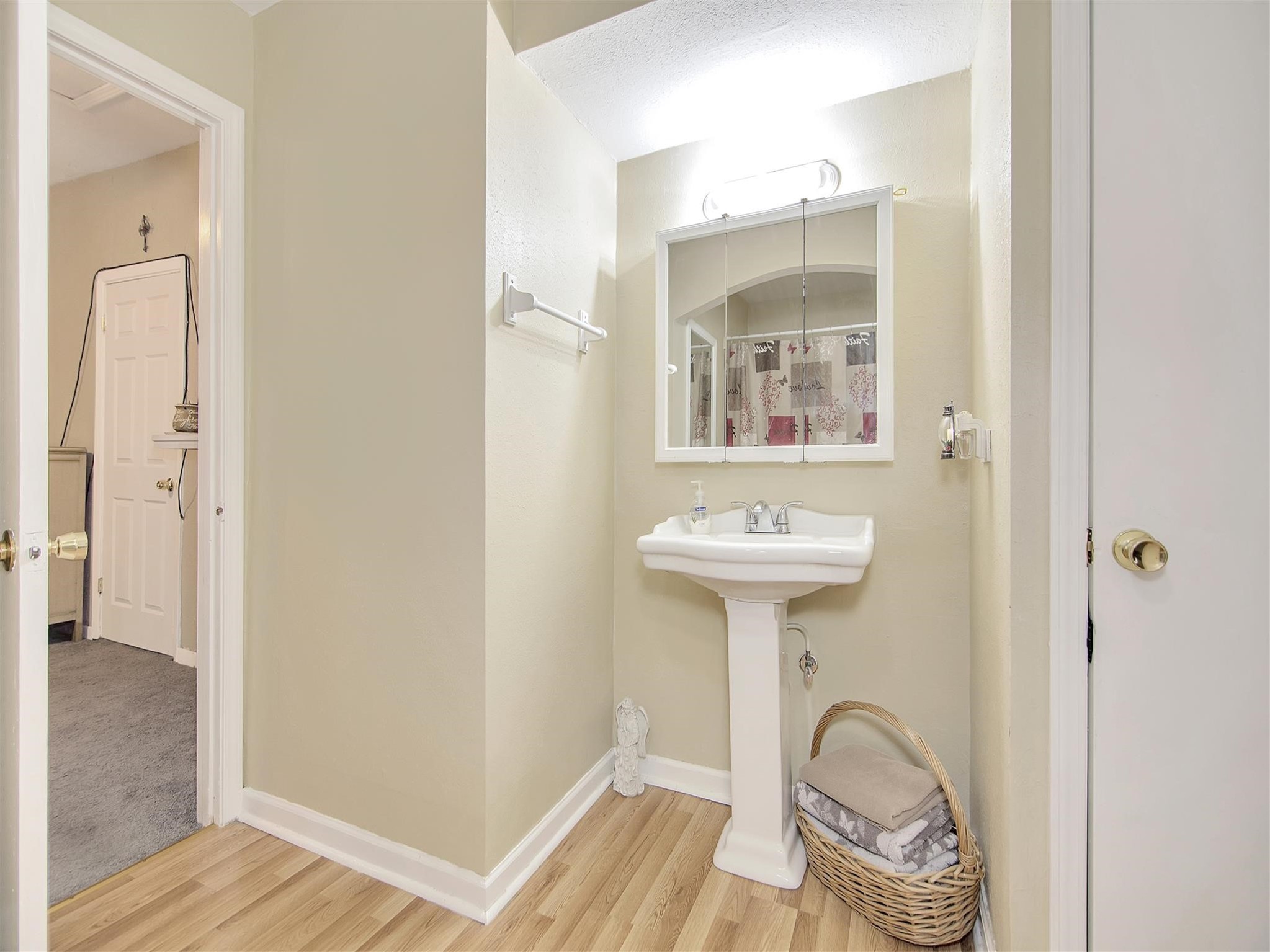 5207 McCormick Street Houston, TX 77023 - Photo 29 of 33 a bathroom with a sink a mirror and a shower