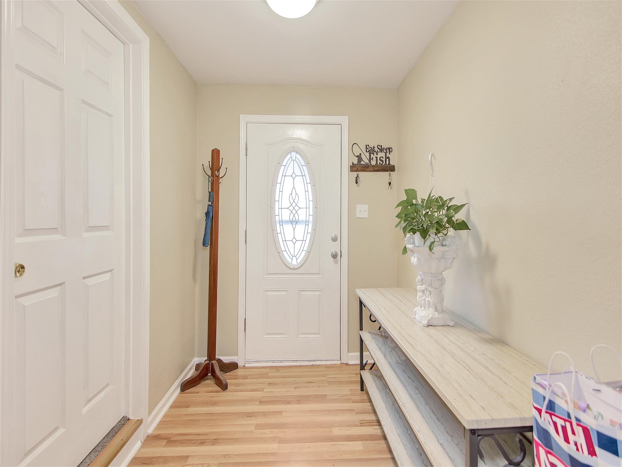 5207 McCormick Street Houston, TX 77023 - Photo 5 of 33 a bathroom with a sink a mirror and a potted plant