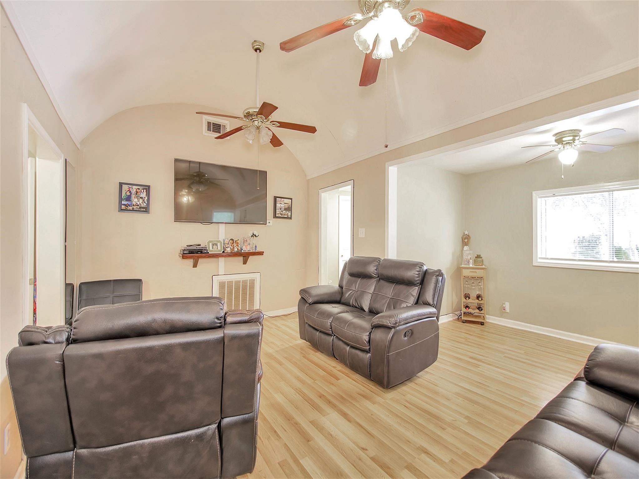 5207 McCormick Street Houston, TX 77023 - Photo 7 of 33 a living room with furniture and a wooden floor