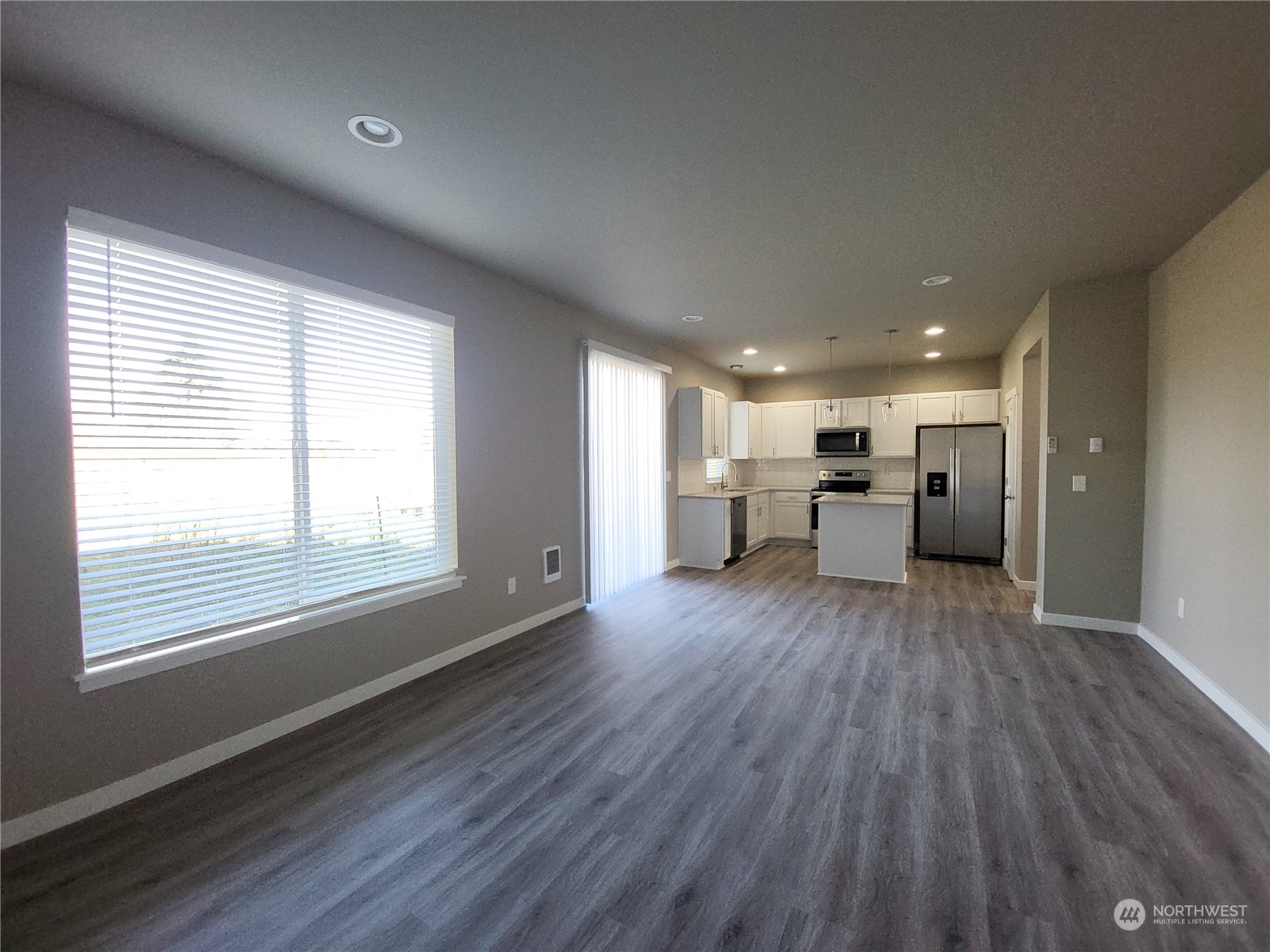 1026 Peach Road Winlock, WA 98596 - Photo 16 of 37 a view of empty room with wooden floor